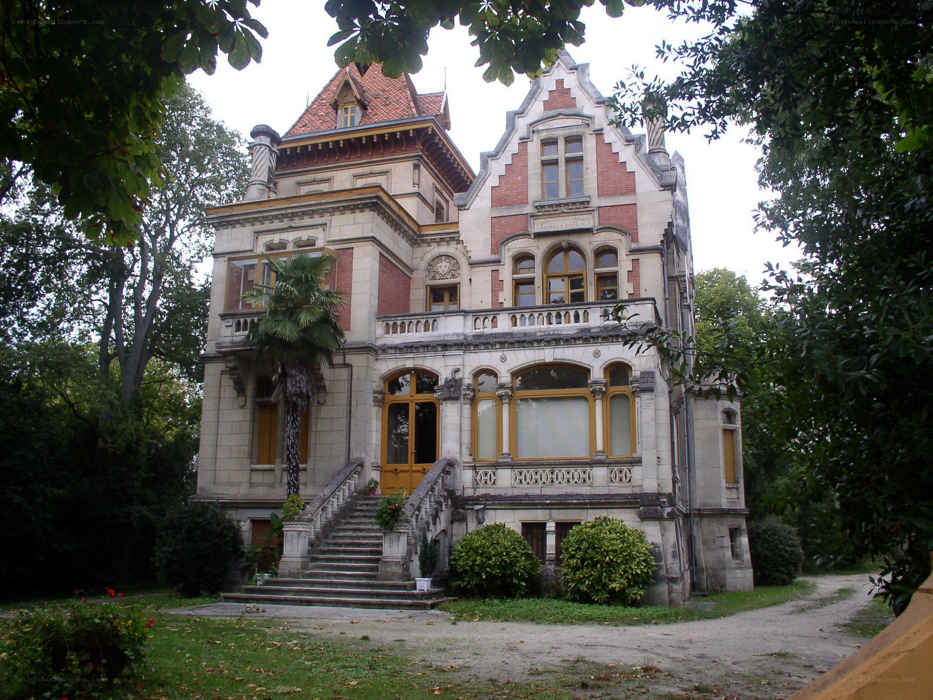 ornate mansion with stone staircase