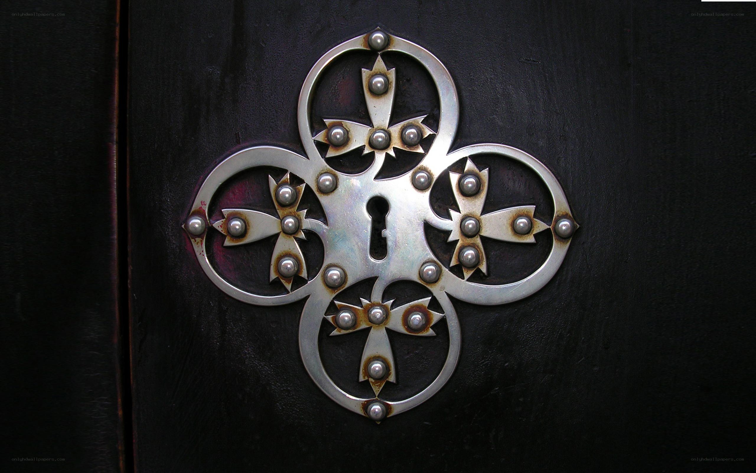 ornate metal door lock plate