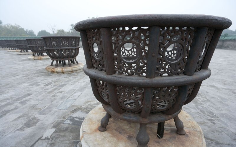 ornate metal urns on a terrace