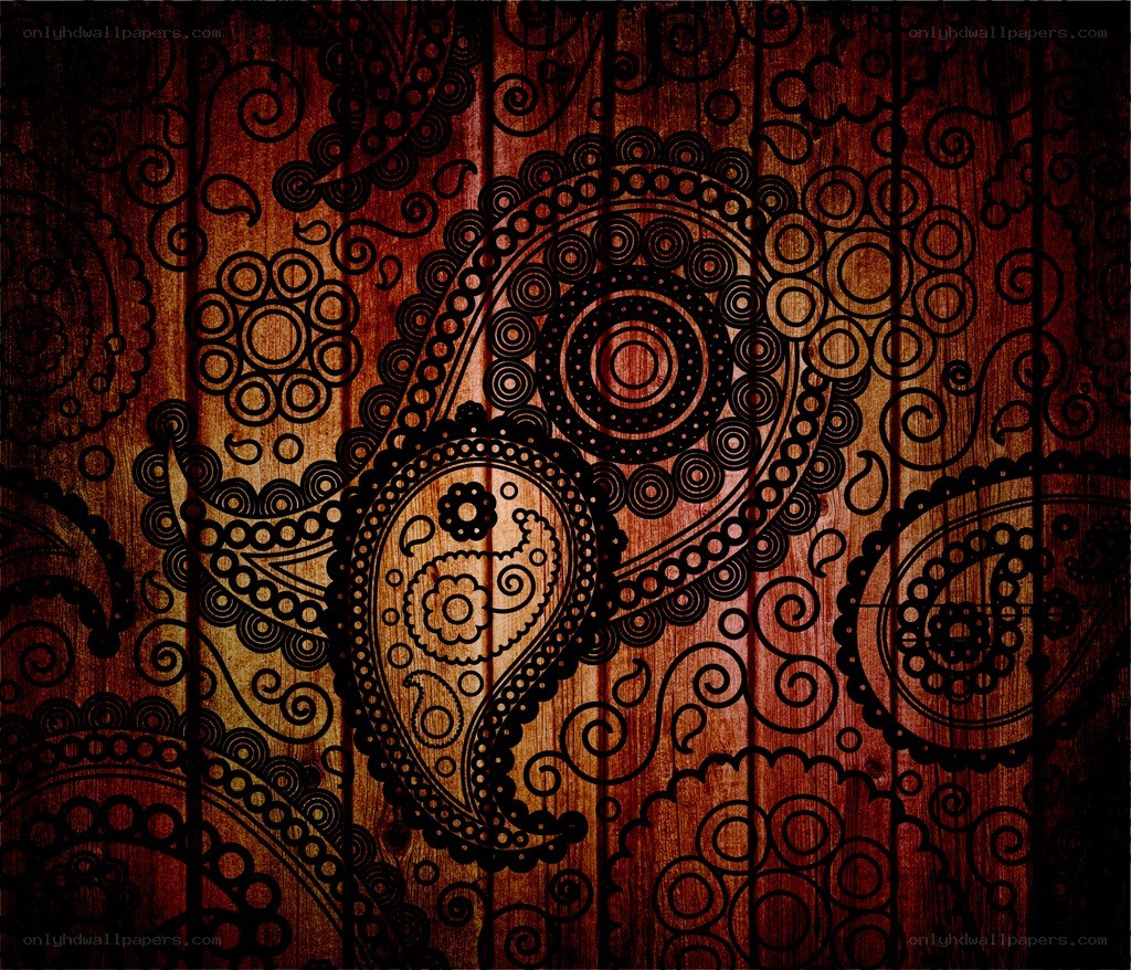 ornate paisley pattern on wood