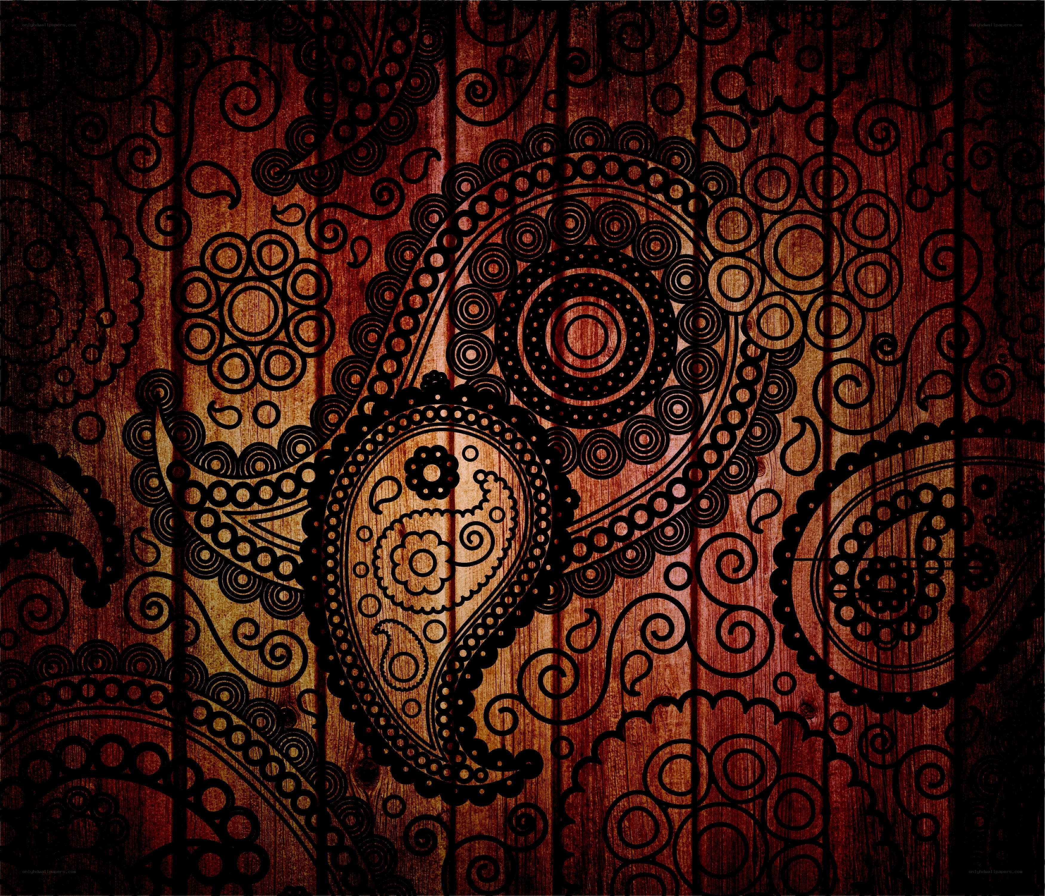 ornate paisley pattern on wood
