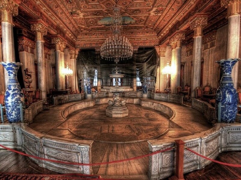 ornate palace hall with chandelier