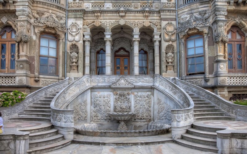 ornate palace staircase and fountain