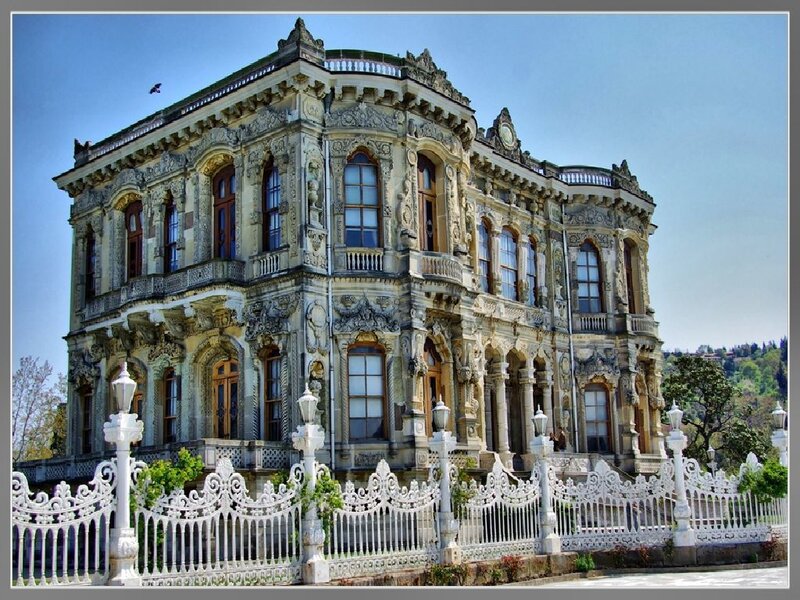 ornate palace with white fence