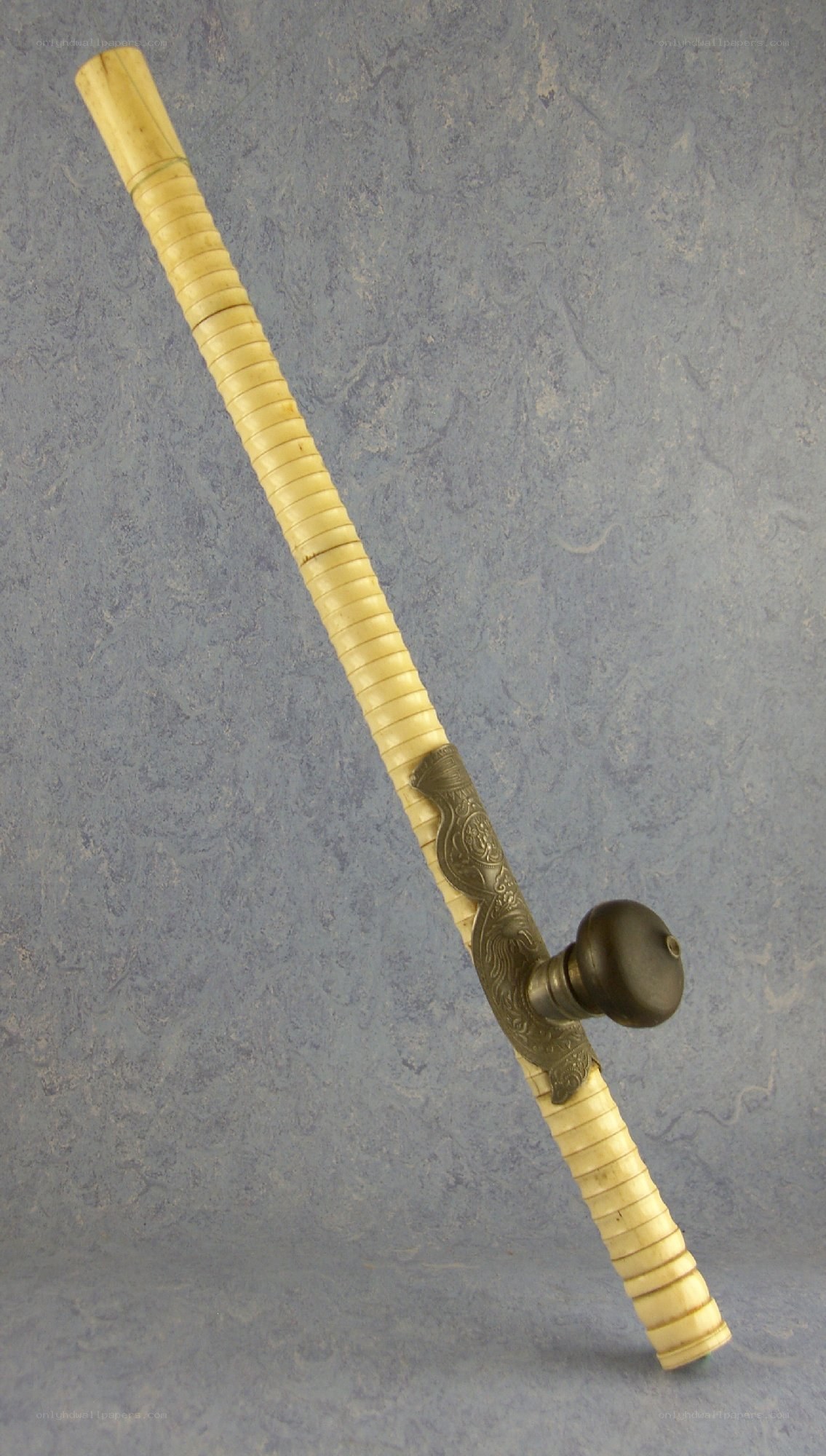 ornate pipe with carved handle