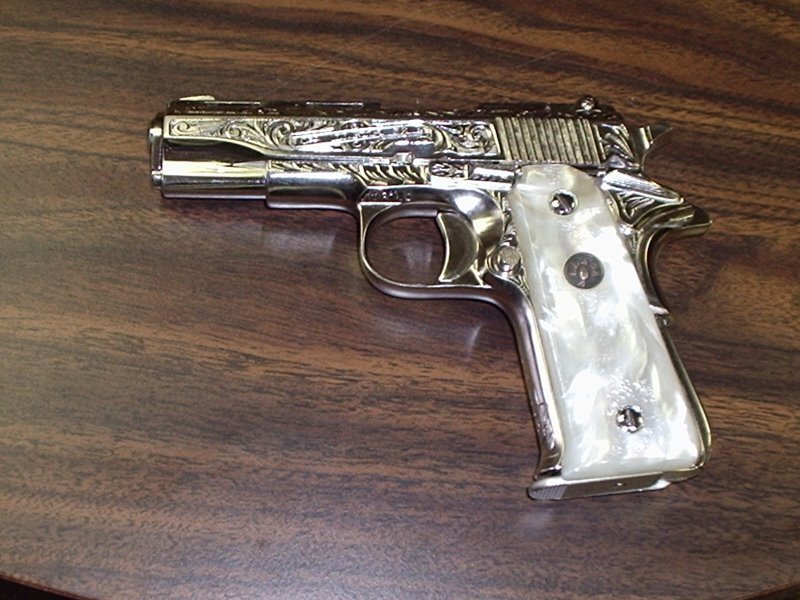 ornate pistol on wooden surface