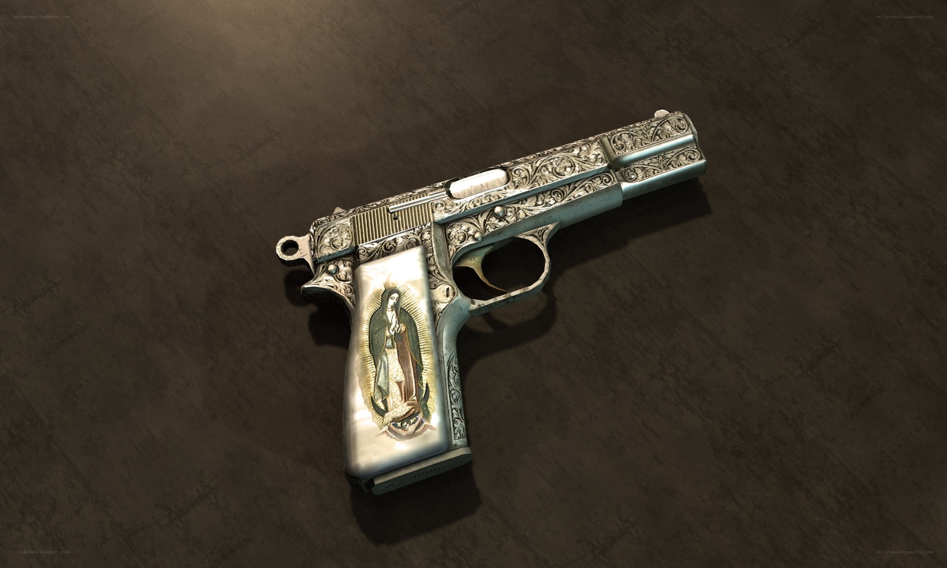 ornate pistol with religious image