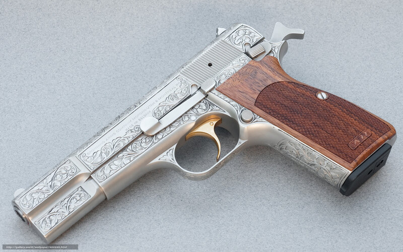 ornate pistol with wooden grip
