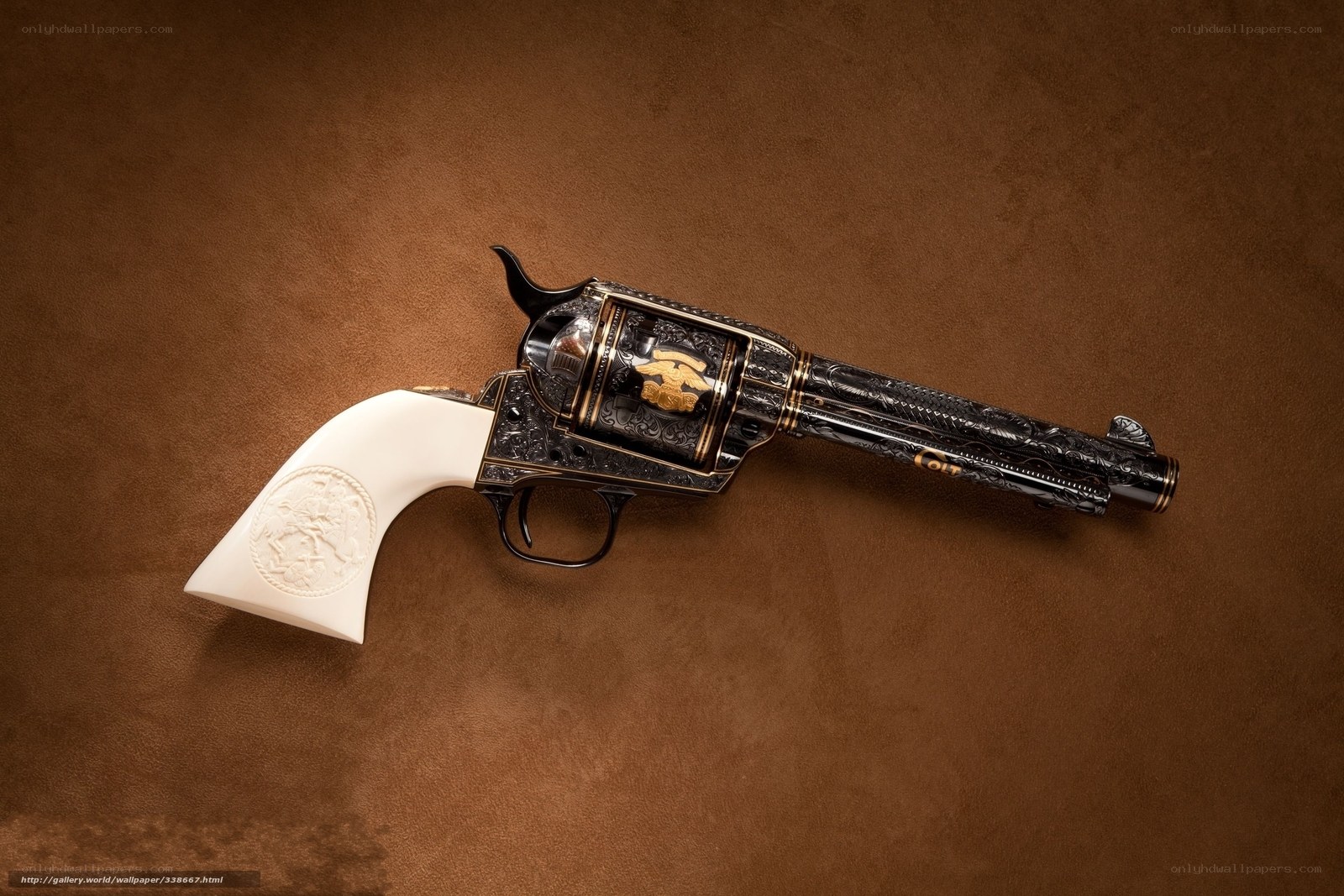 ornate revolver on brown surface