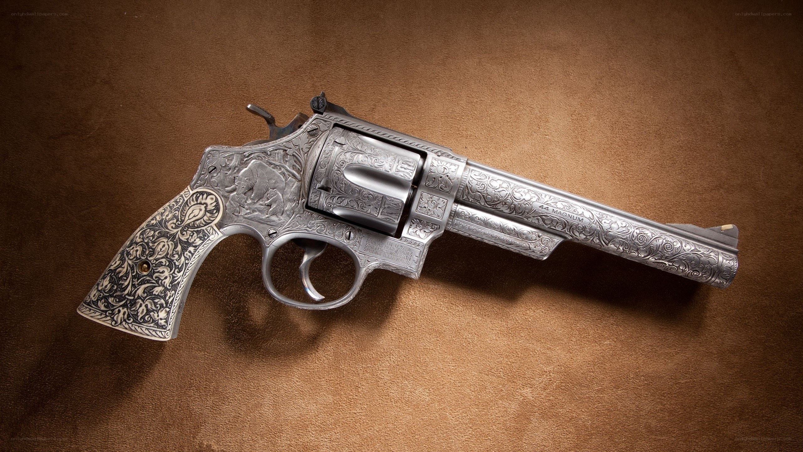 ornate revolver on brown surface