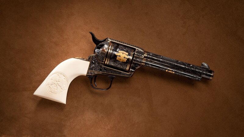 ornate revolver on brown surface