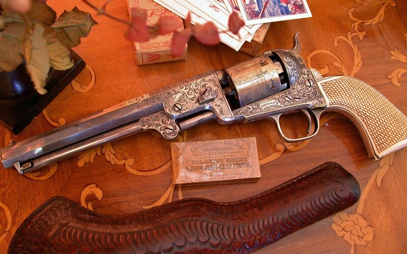 ornate revolver on wooden table