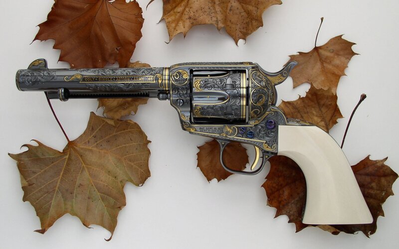 ornate revolver with autumn leaves