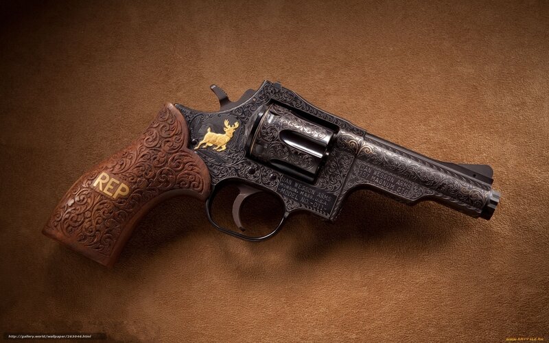 ornate revolver with deer emblem