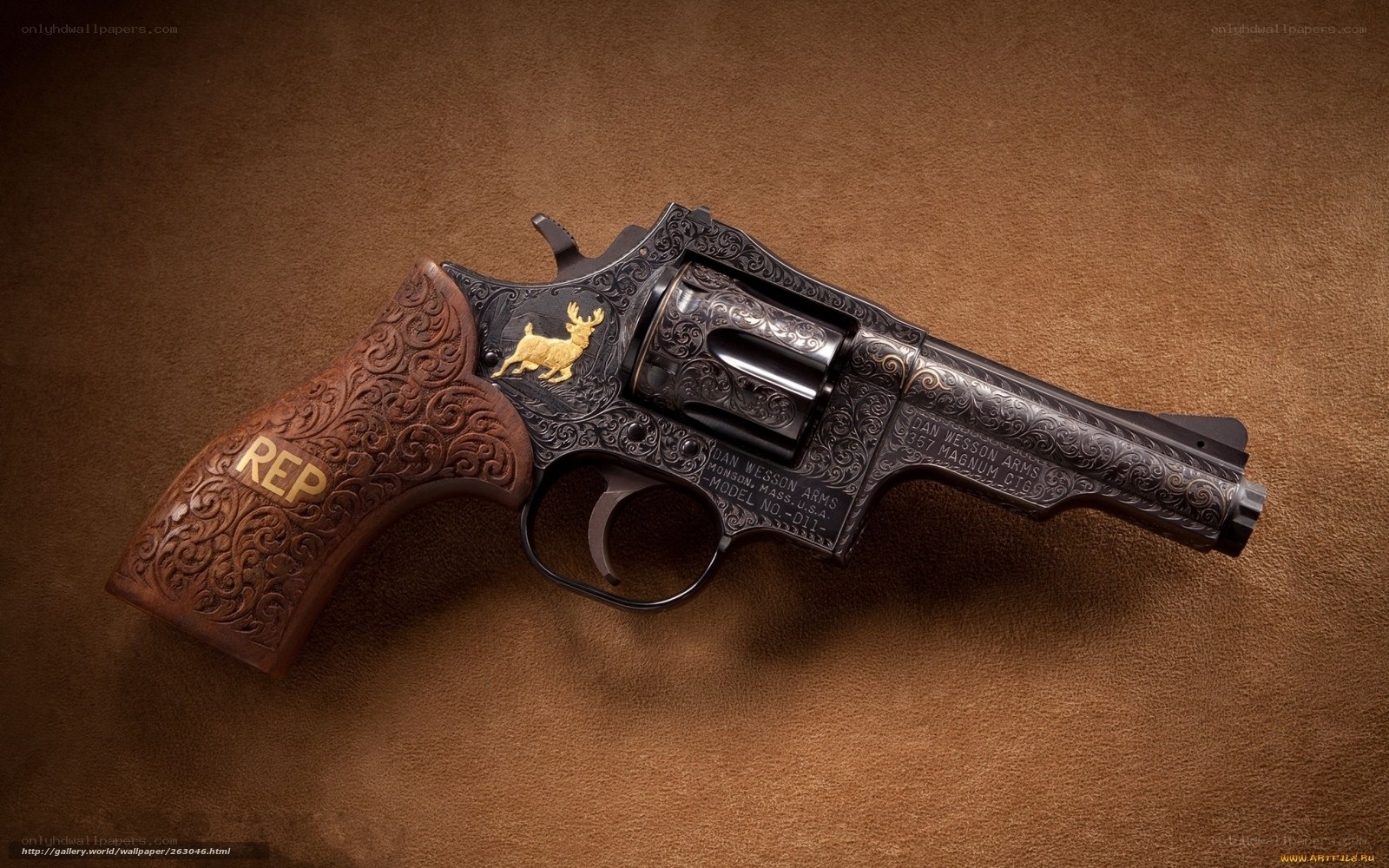 ornate revolver with deer emblem