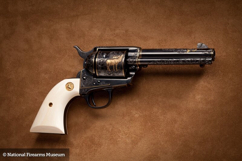 ornate revolver with elk engraving