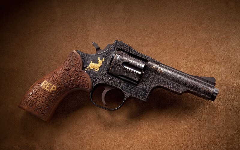 ornate revolver with gold details