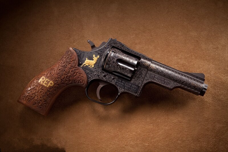 ornate revolver with gold details