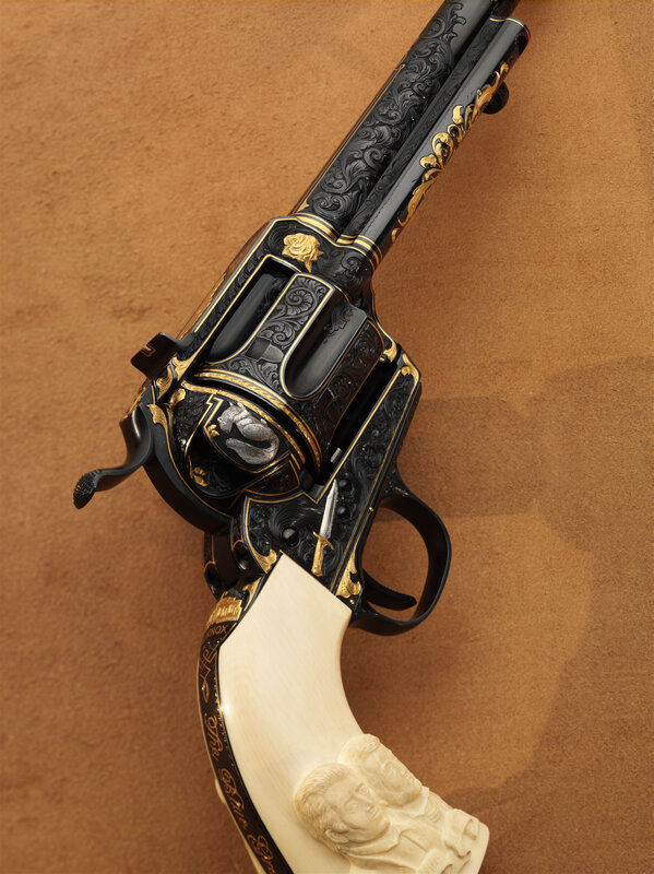 ornate revolver with ivory grip