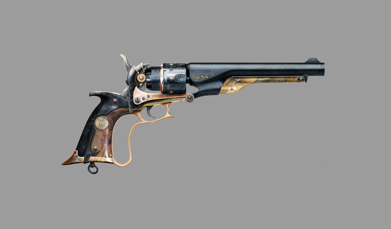 ornate revolver with wooden grip