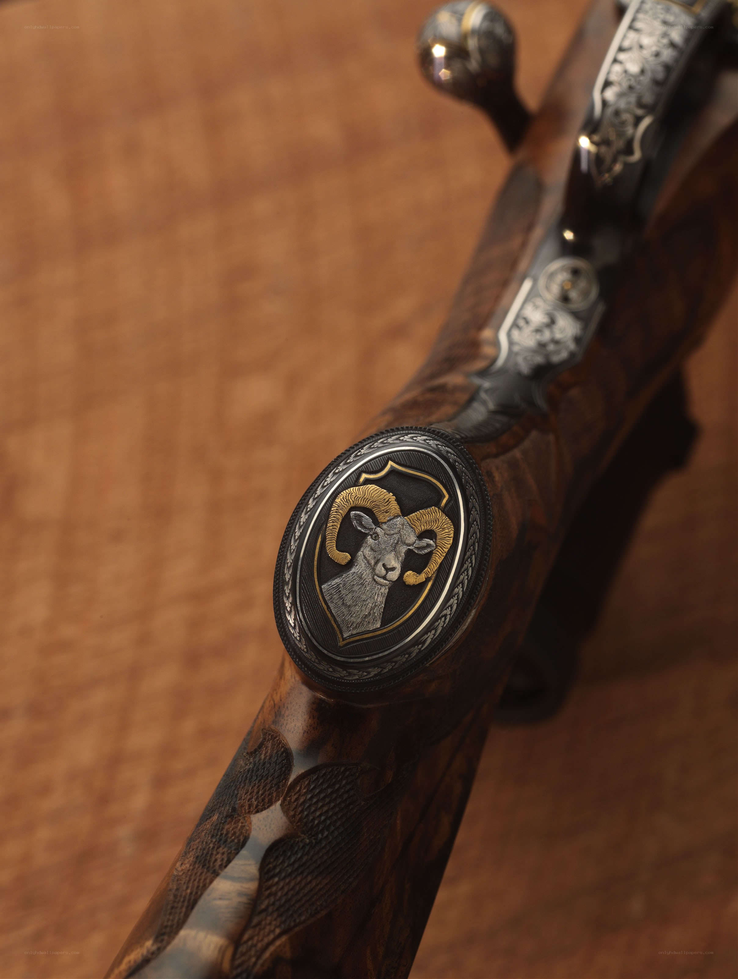 ornate rifle with ram emblem