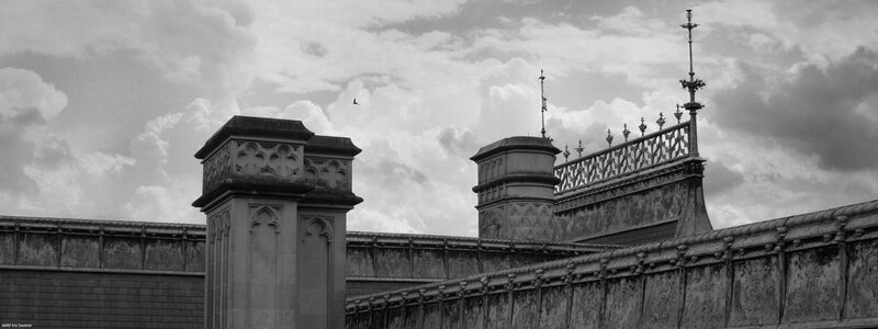 ornate roofline with clouds