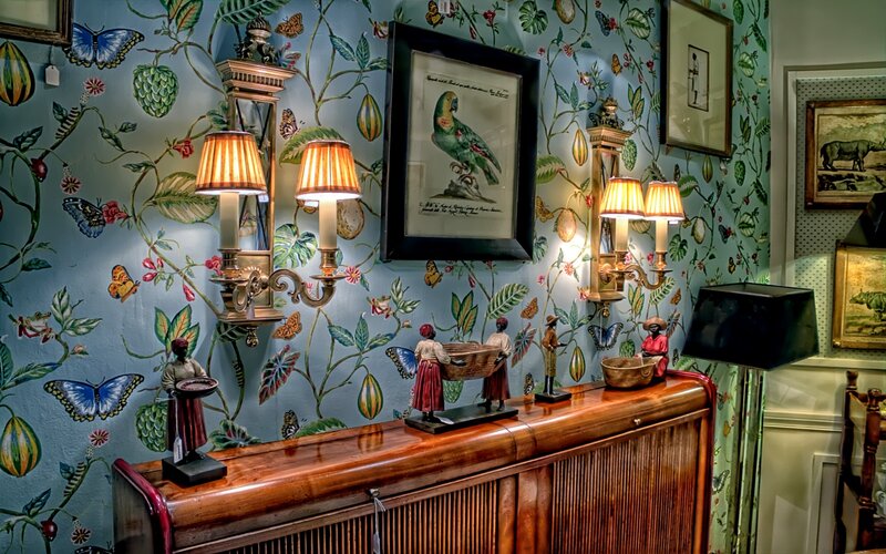 ornate room with patterned wallpaper