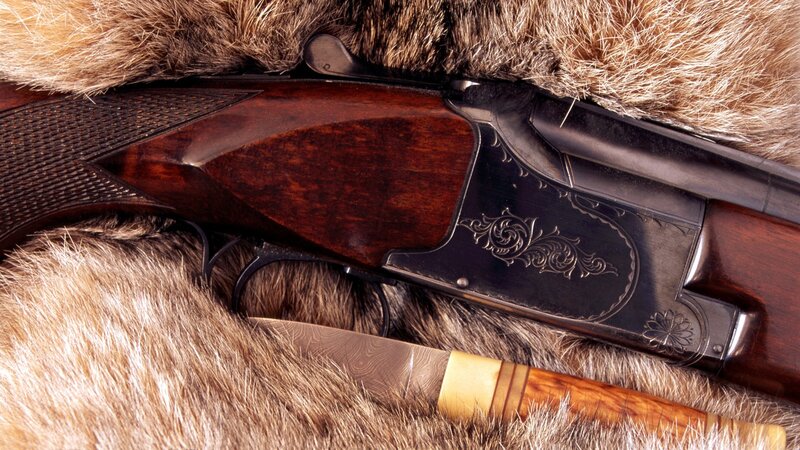 ornate shotgun and knife