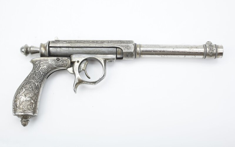 ornate silver pistol