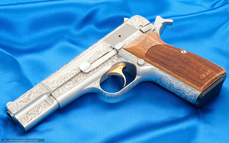 ornate silver pistol with wood grip