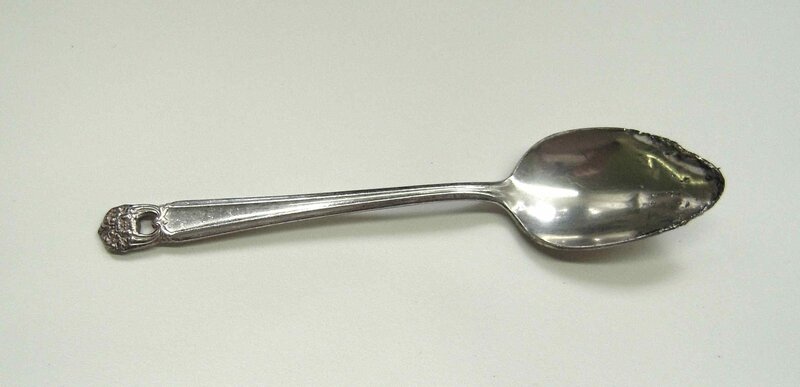 ornate silver spoon
