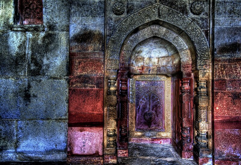 ornate stone archway with calligraphy