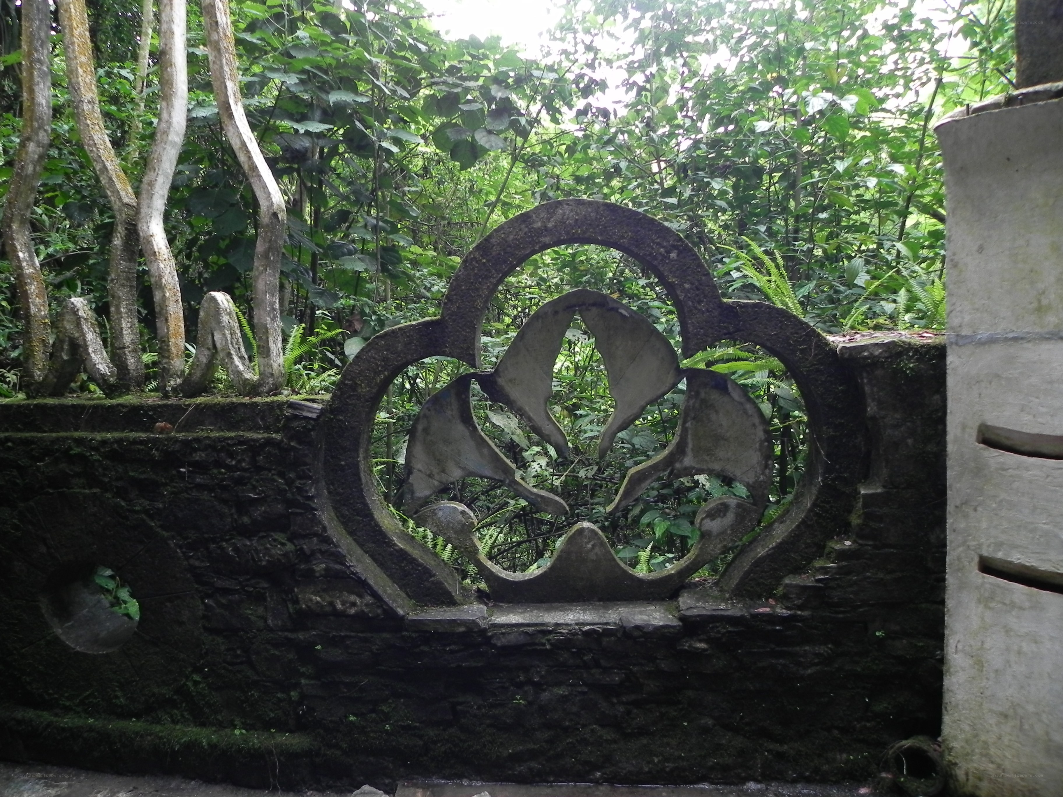 ornate stone carving in garden