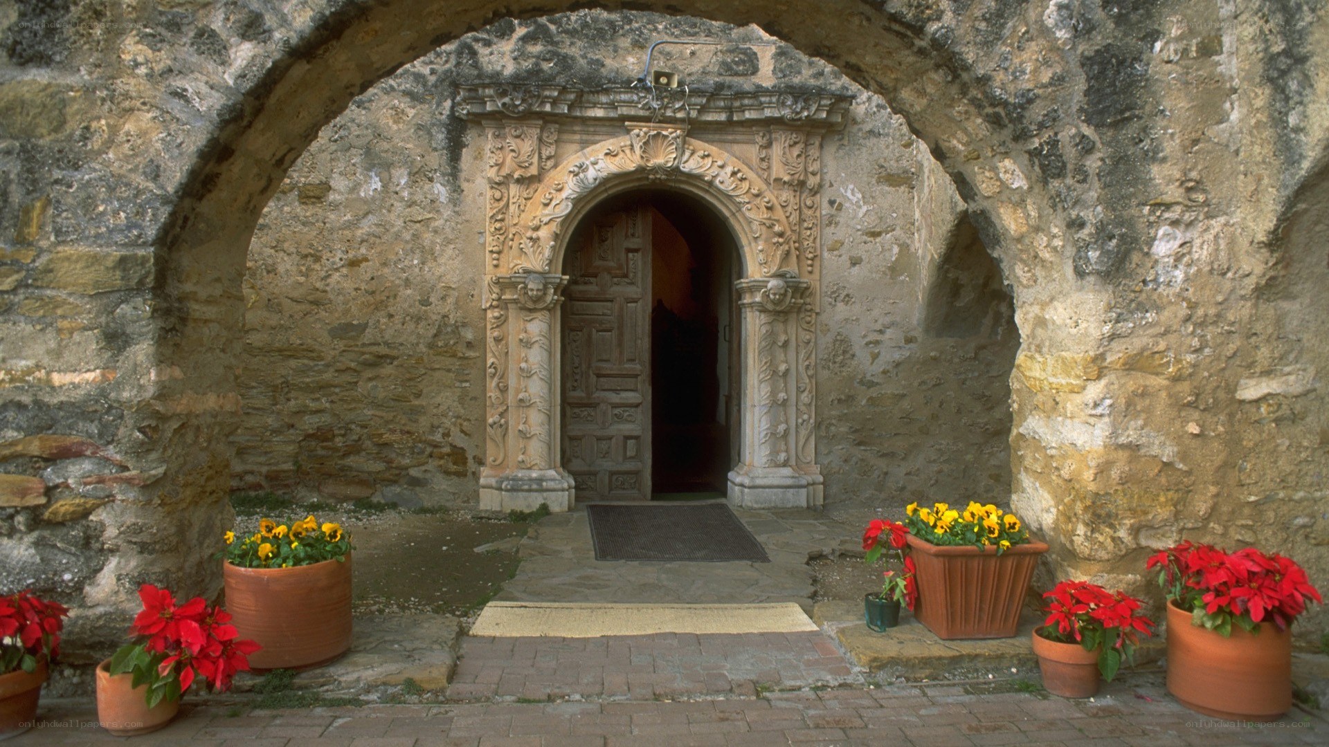 ornate stone doorway with flowers