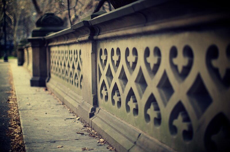 ornate stone fence in park
