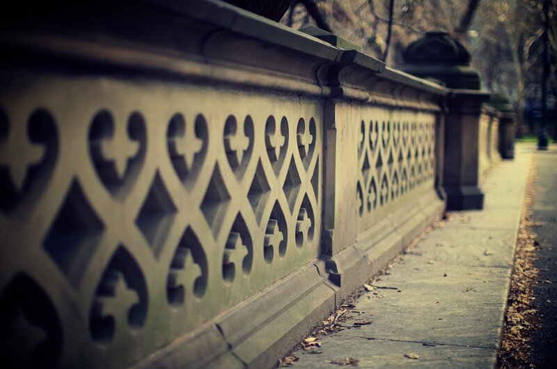 ornate stone fence in park