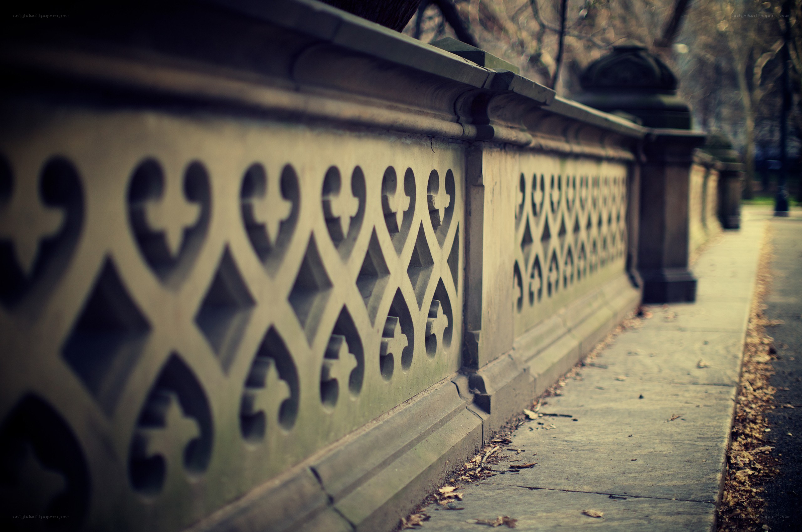 ornate stone fence in park