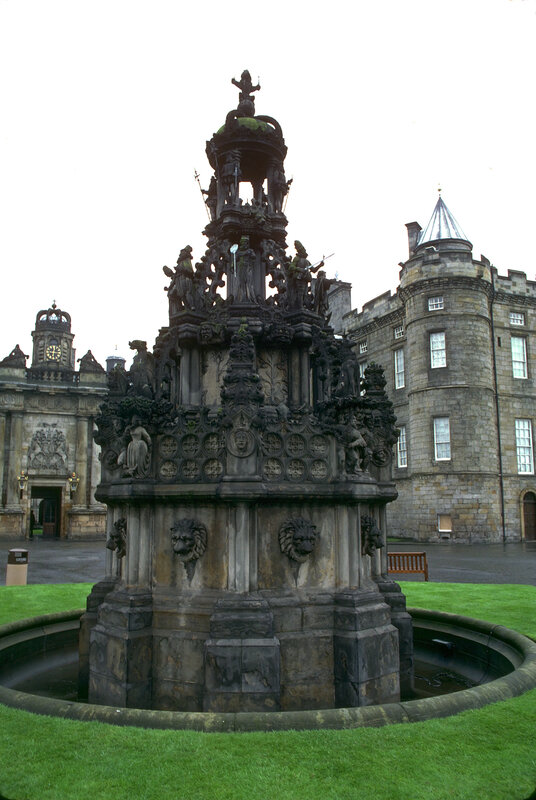 ornate stone fountain at castle