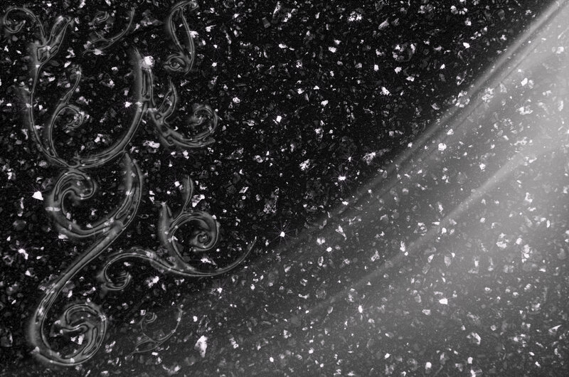 Ornate Swirls on Dark Surface