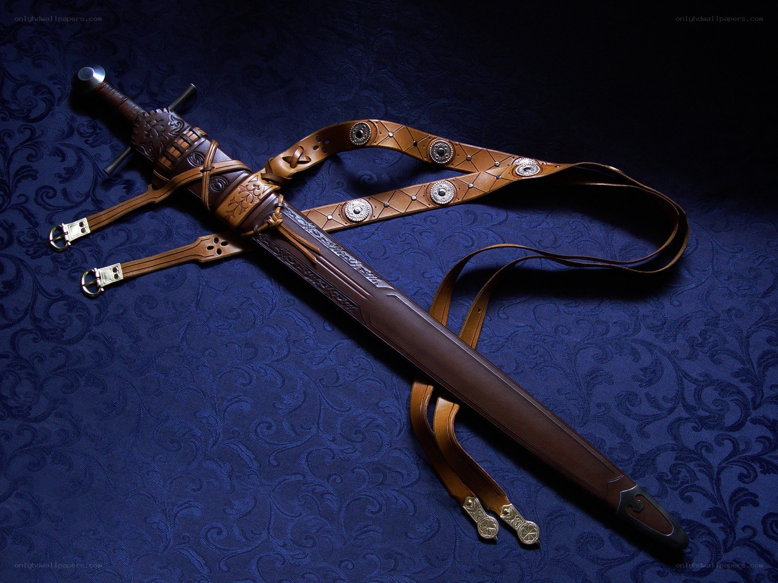 ornate sword and leather strap