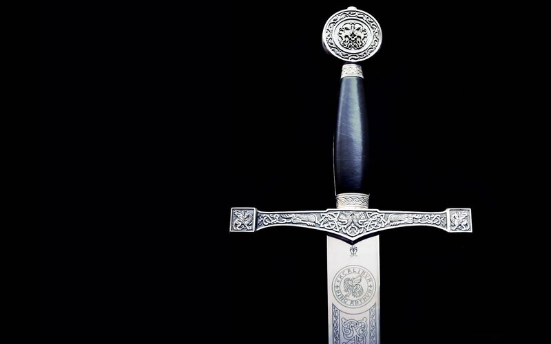 Ornate Sword on Black — Dramatic
