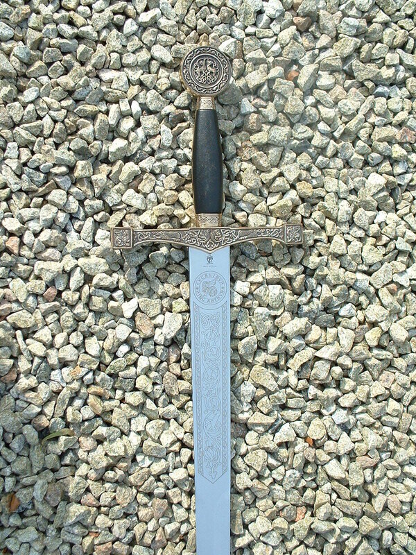 ornate sword on gravel