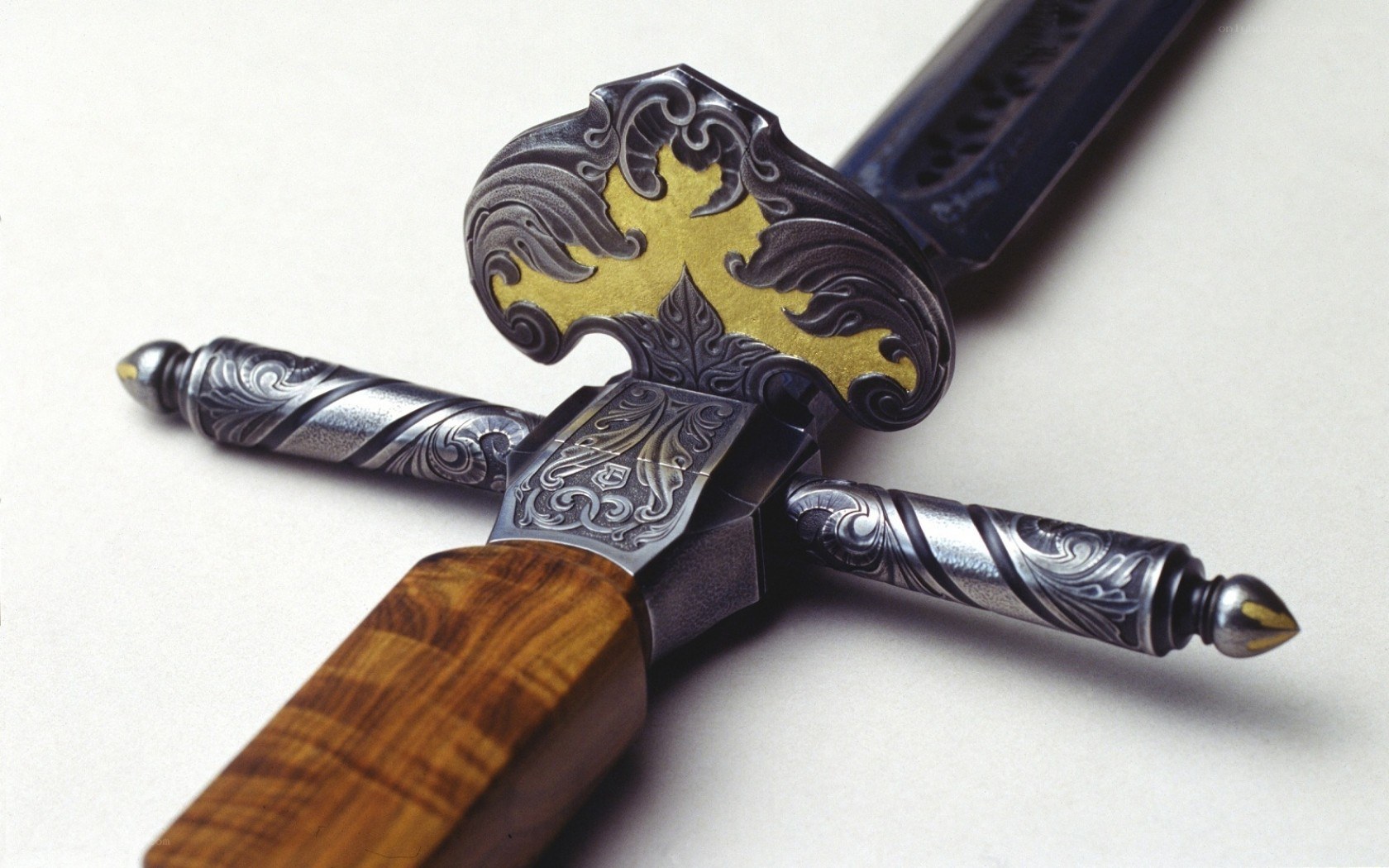 ornate sword with gold cross