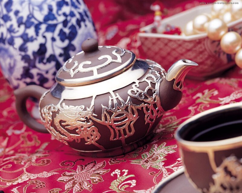 Ornate Teapot on Cloth