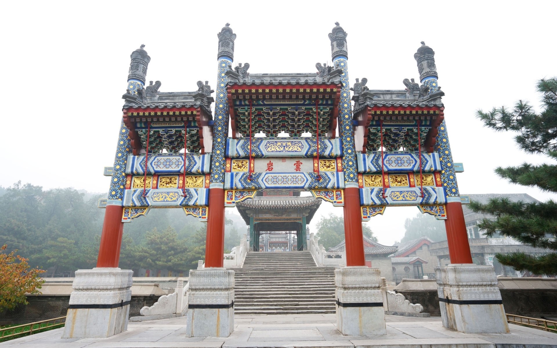 ornate temple gate in mist