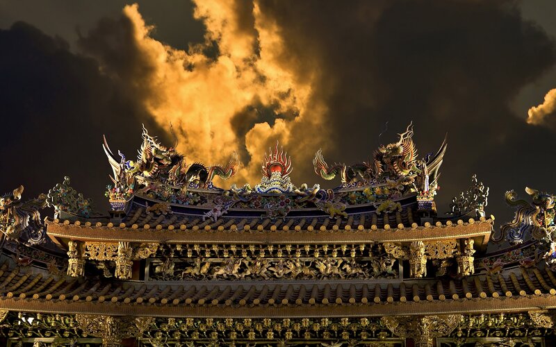 ornate temple roof at dusk
