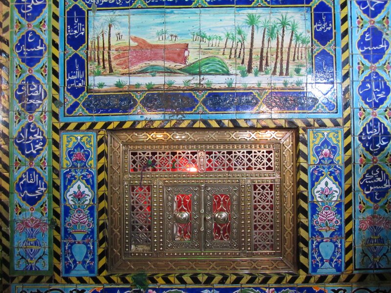 ornate tile wall with shrine