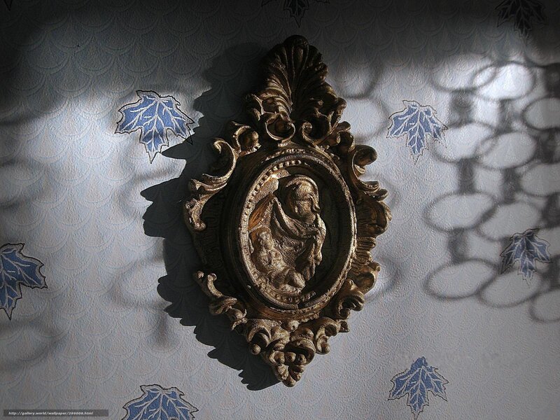 Ornate wall medallion with shadow