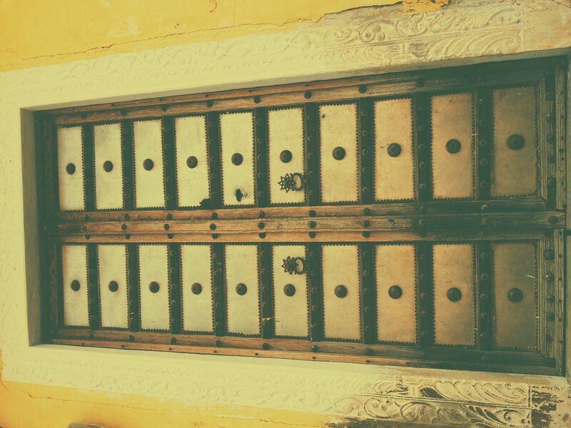 Ornate Wooden Door — Yellow