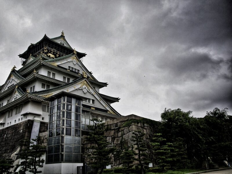 Osaka Castle under stormy sky